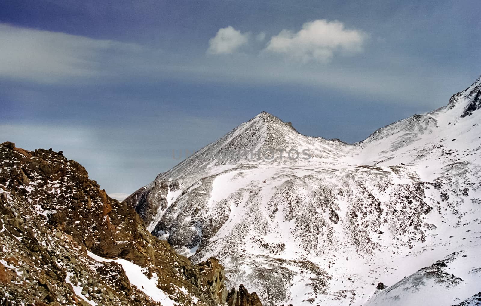 Mount Sayan in winter in the snow. The nature of the mountains is sayan.