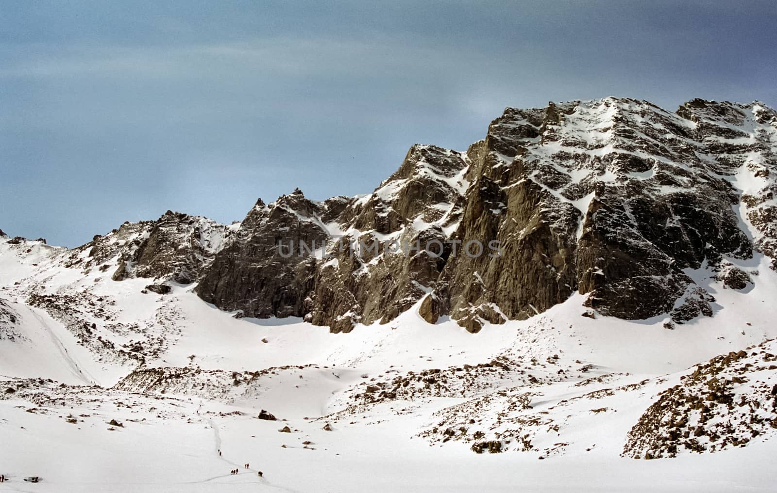 Mount Sayan in winter in the snow. The nature of the mountains is sayan.