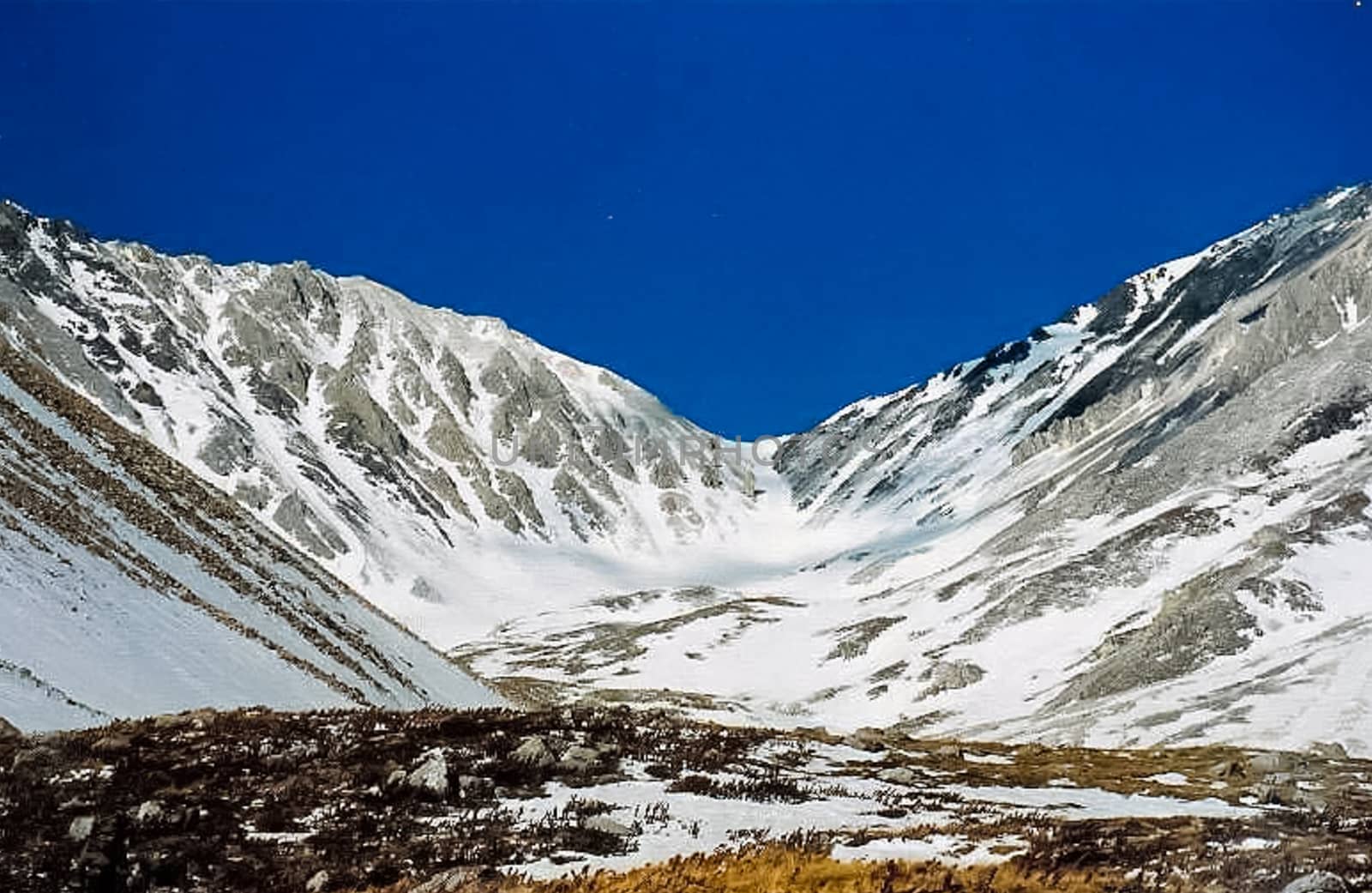 Mount Sayan in winter in the snow. The nature of the mountains is sayan.