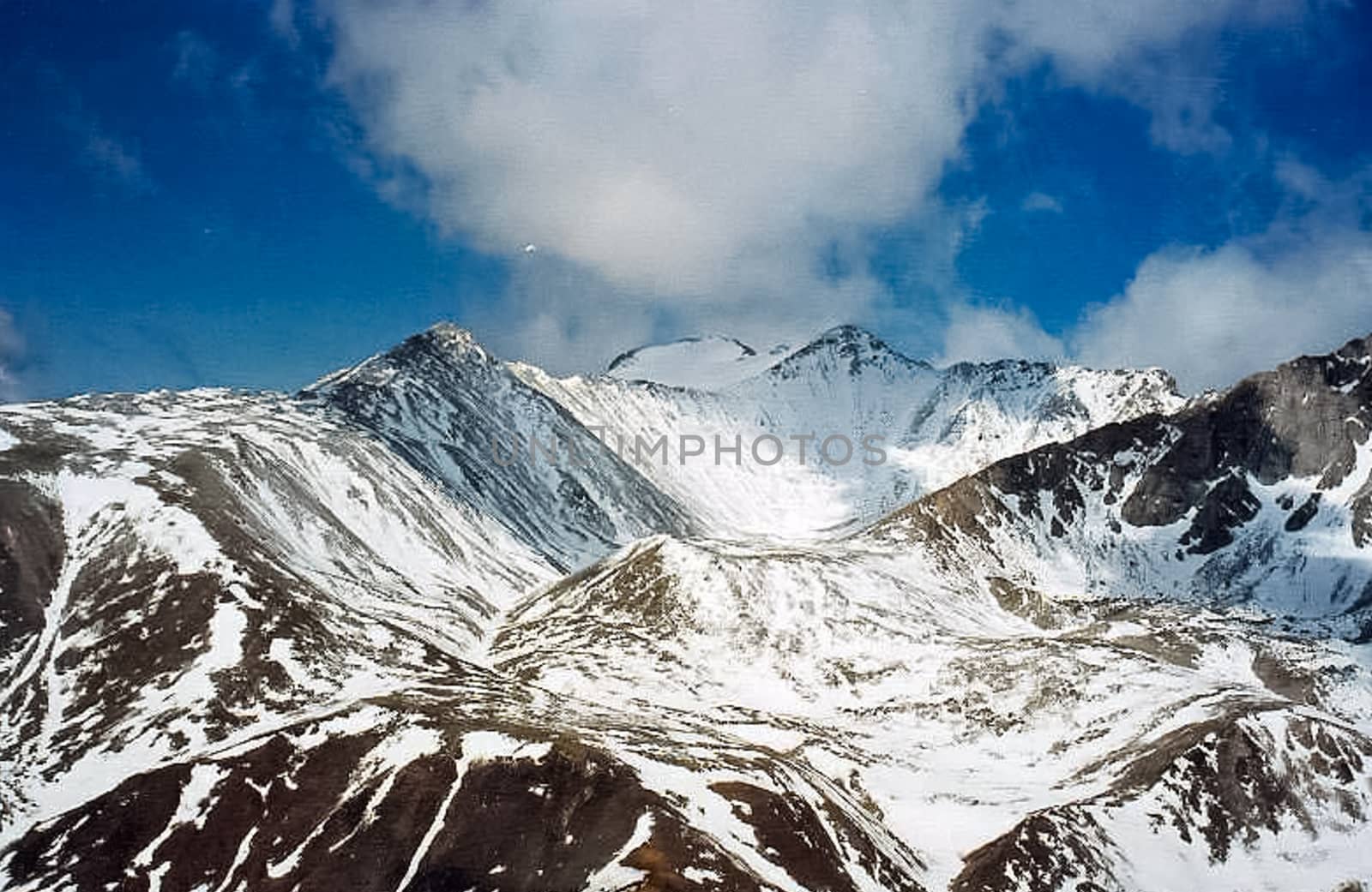 Mount Sayan in winter in the snow. The nature of the mountains is sayan.