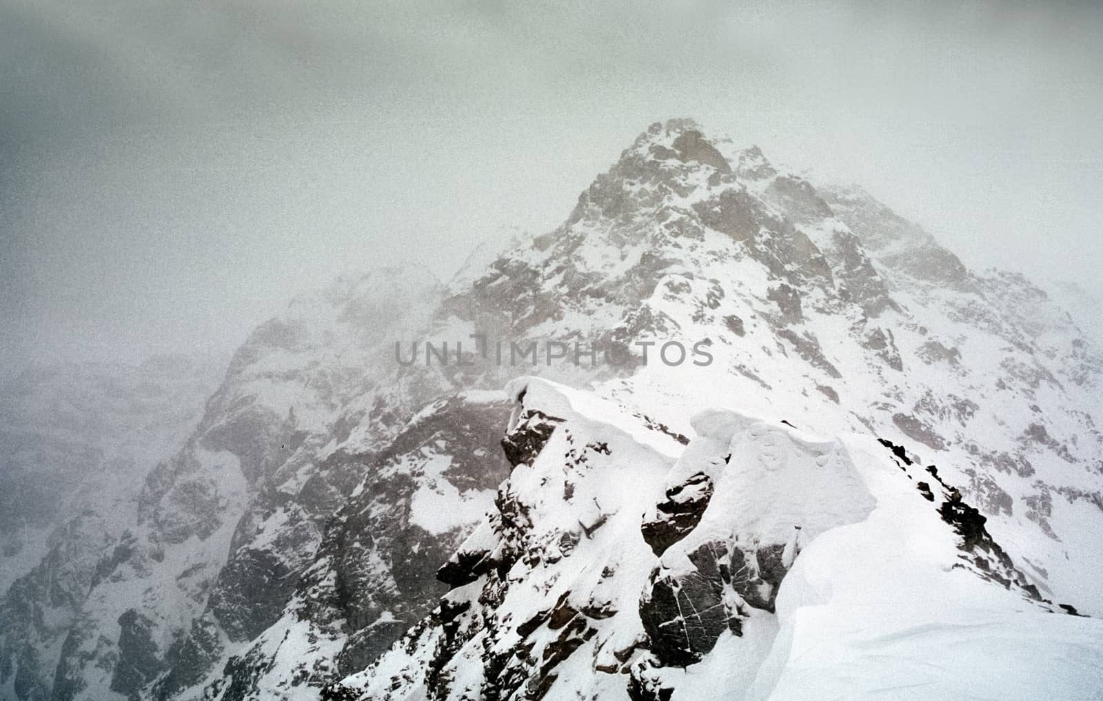 Mount Sayan in winter in the snow. The nature of the mountains is sayan.