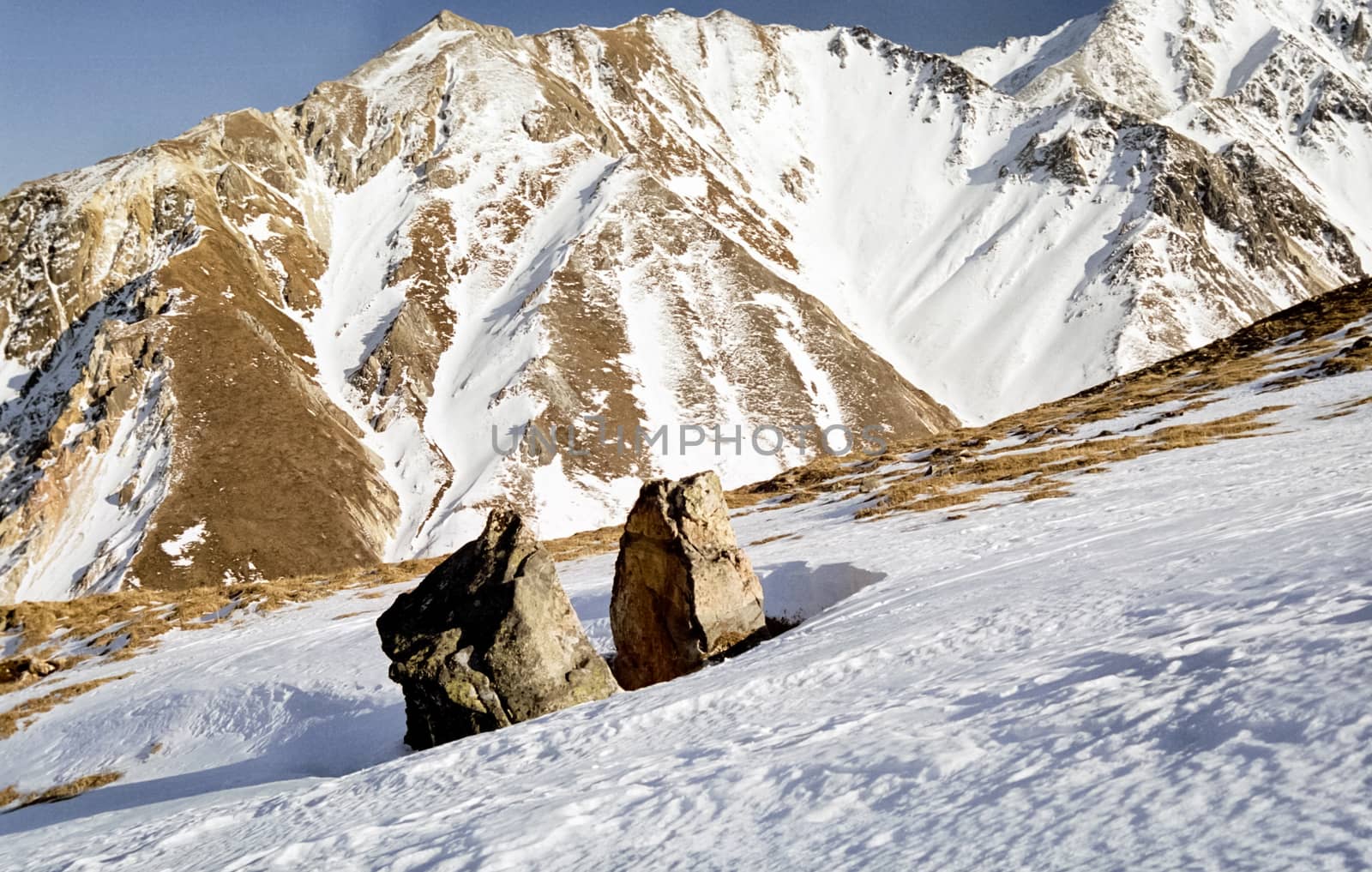 Mount Sayan in winter in the snow. The nature of the mountains is sayan.