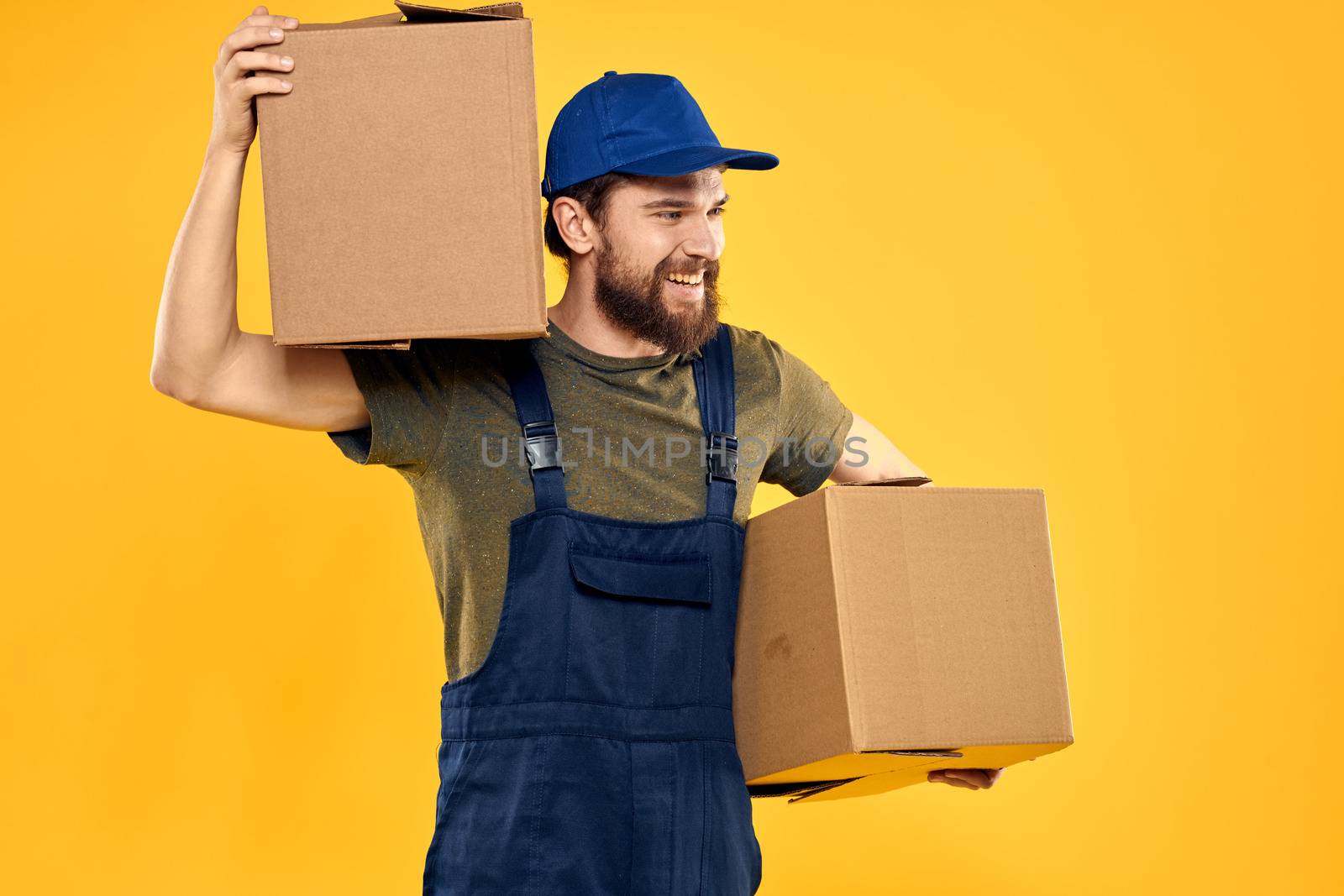 working man with box in hands delivery loading transportation service. High quality photo