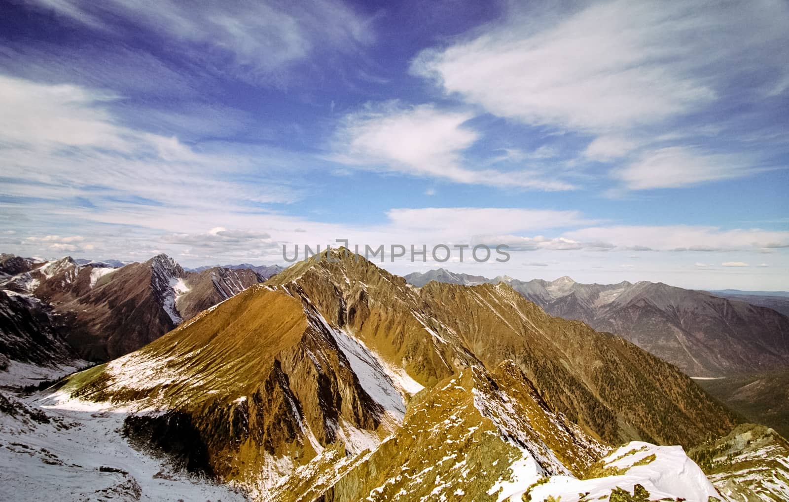 Mount Sayan in winter in the snow. The nature of the mountains is sayan.