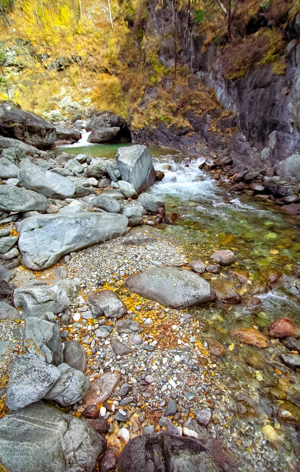 Mountain river. Stones and water of a mountain river. The mountains are said.