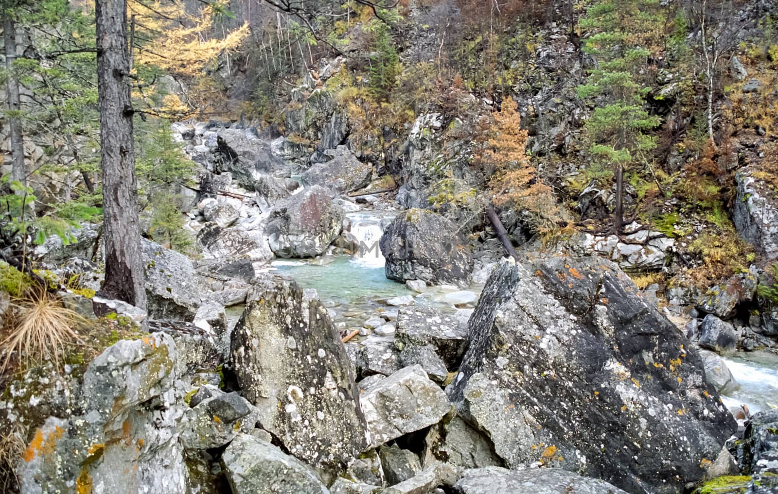 Mountain river. Stones and water of a mountain river. The mountains are said.