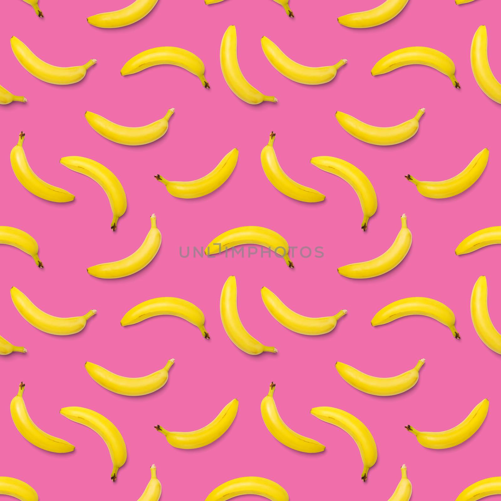 Bananas seamless pattern. pop art bananas pattern. Tropical abstract background with banana. Colorful fruit pattern of yellow banana on pink background, flat lay