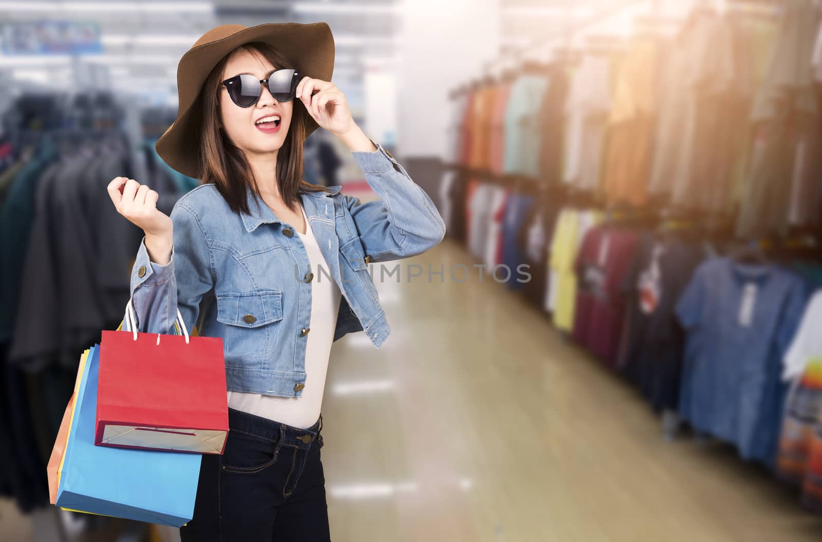 woman teen smiling standing with sunglasses and hat she excited  by Sorapop