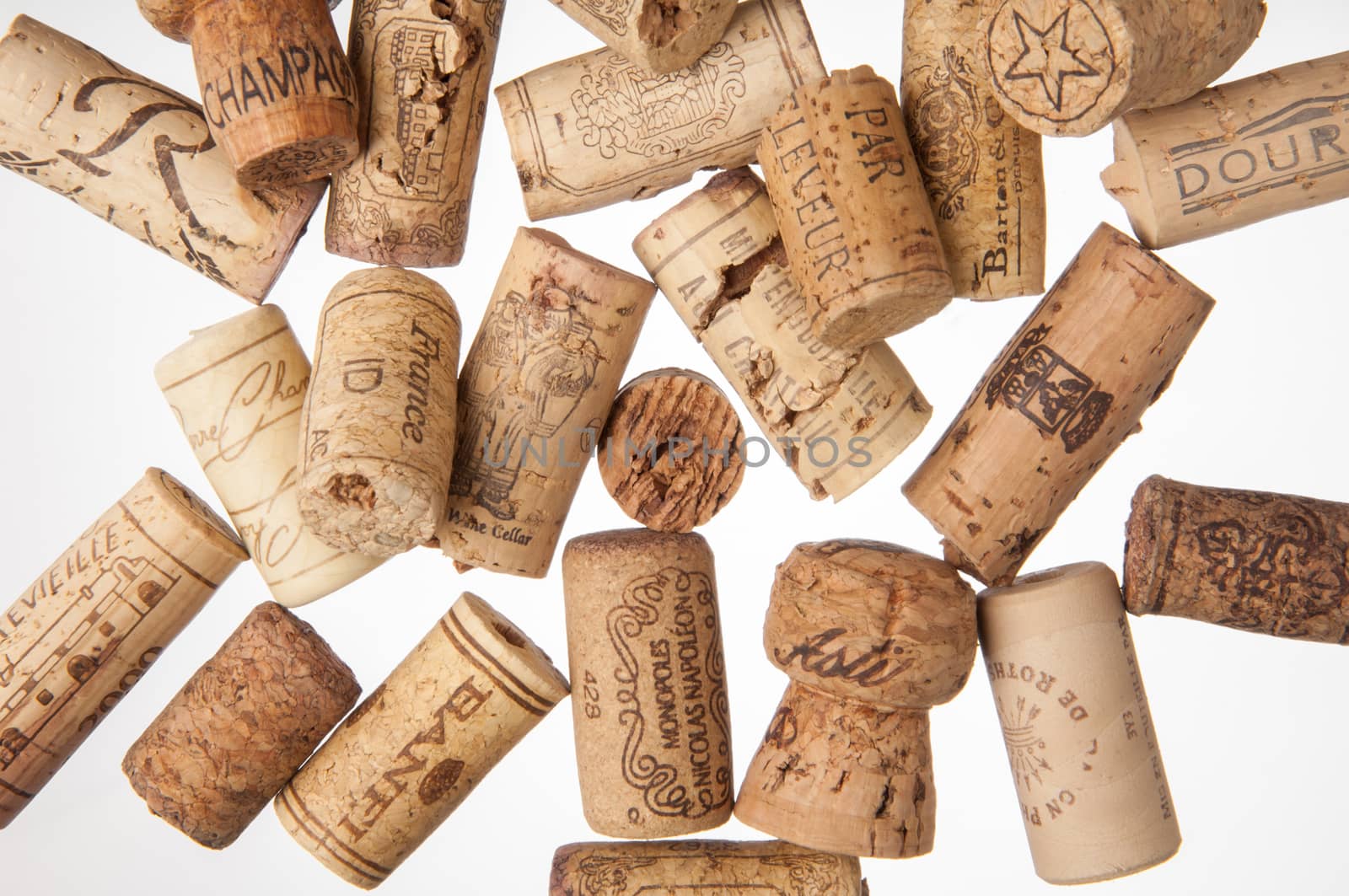 Tashkent, Uzbekistan - March 19, 2008 : Heap of old wine corks on white background. Studio photography