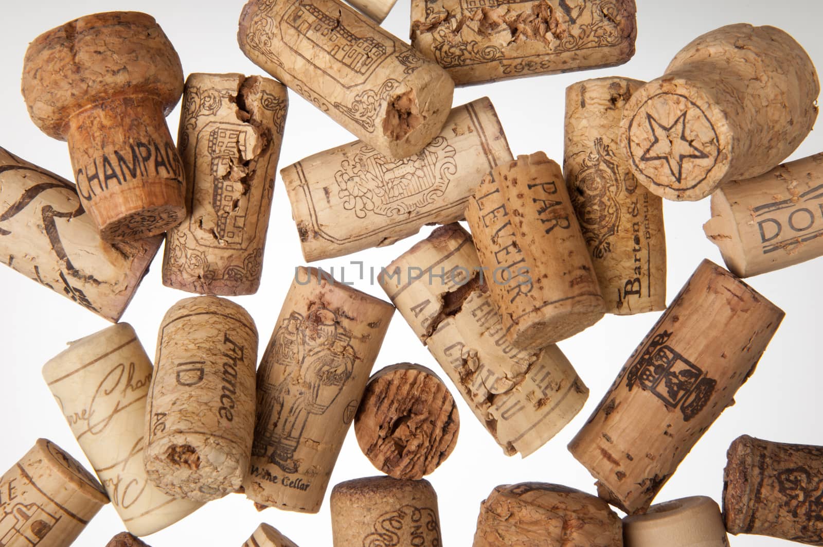 Tashkent, Uzbekistan - March 19, 2008 : Heap of old wine corks on white background. Studio photography
