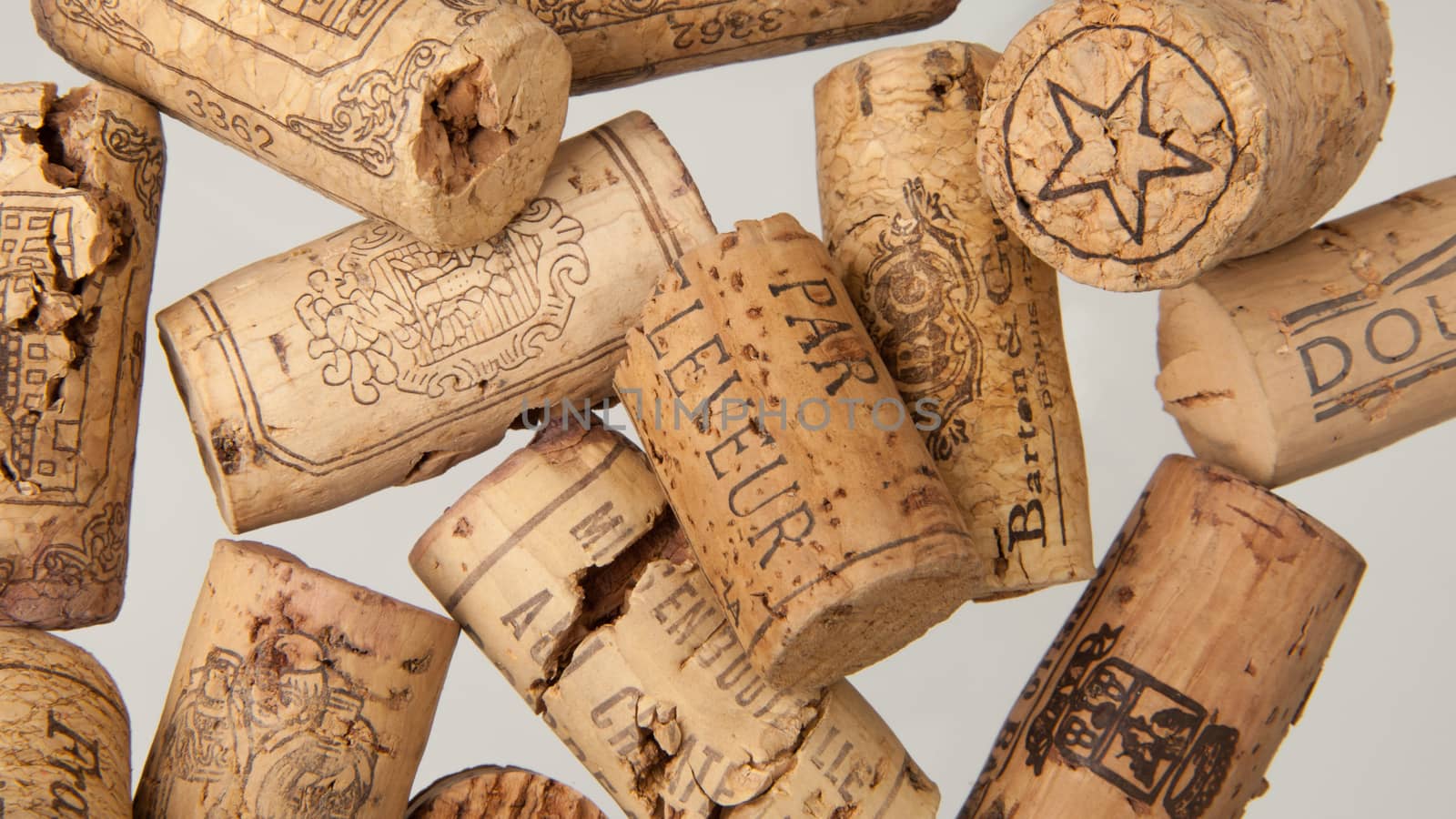 Tashkent, Uzbekistan - March 19, 2008 : Heap of old wine corks on white background. Studio photography