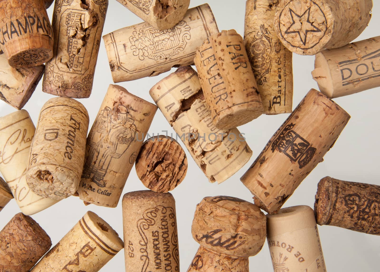 Tashkent, Uzbekistan - March 19, 2008 : Heap of old wine corks on white background. Studio photography