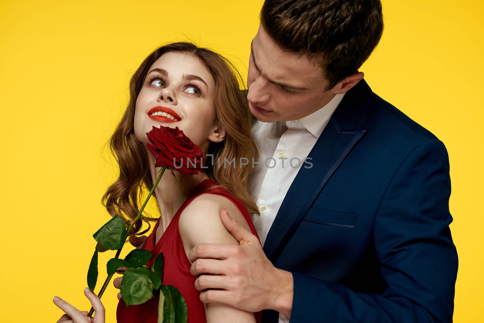 Couple in love man and woman with red rose classic costume red dress model by SHOTPRIME