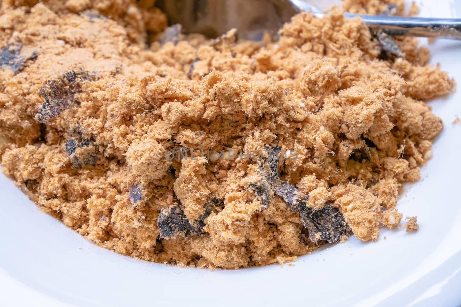 The close up of Taiwan fish floss homemade food on small white bowl.