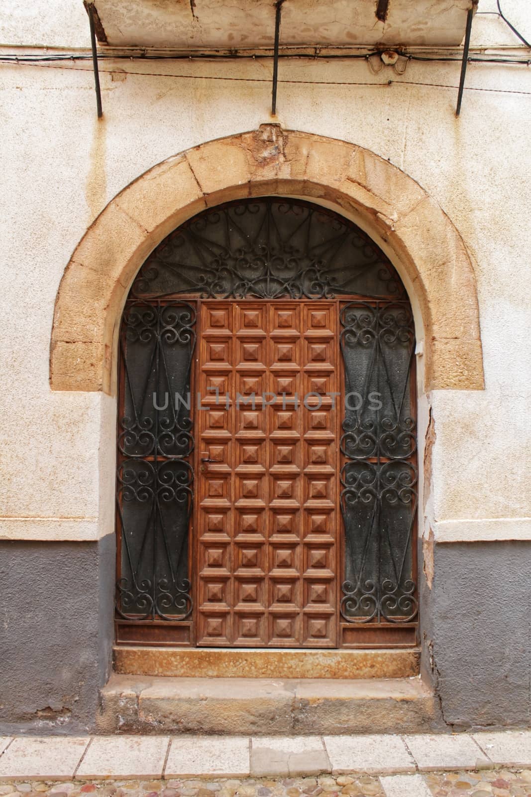 Old facade and entrance of majestic house in Alcaraz, Albacete province, Spain by soniabonet