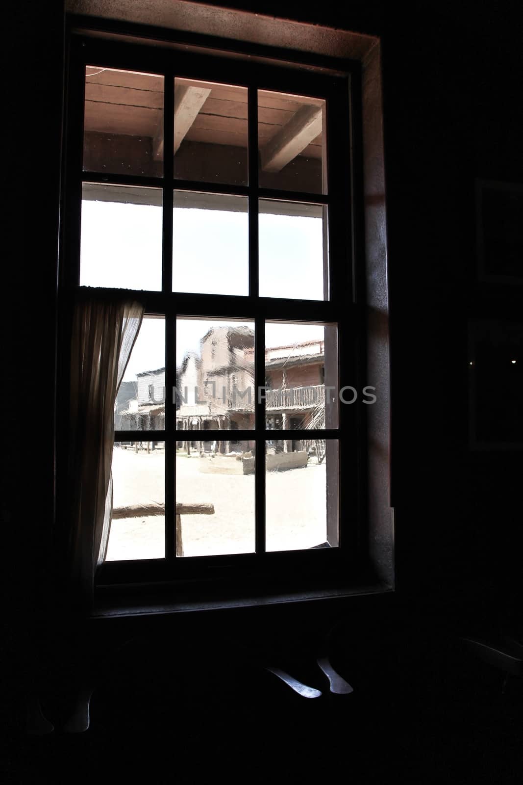 Tavern window in far western town by soniabonet