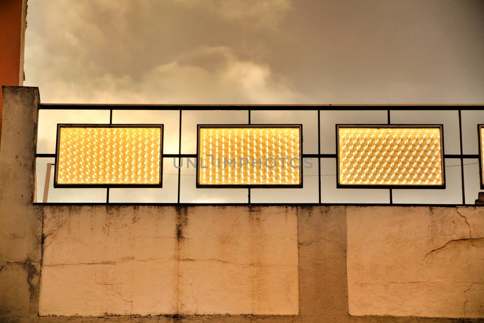 Crystal reflecting golden light at dusk in a building under grey sky