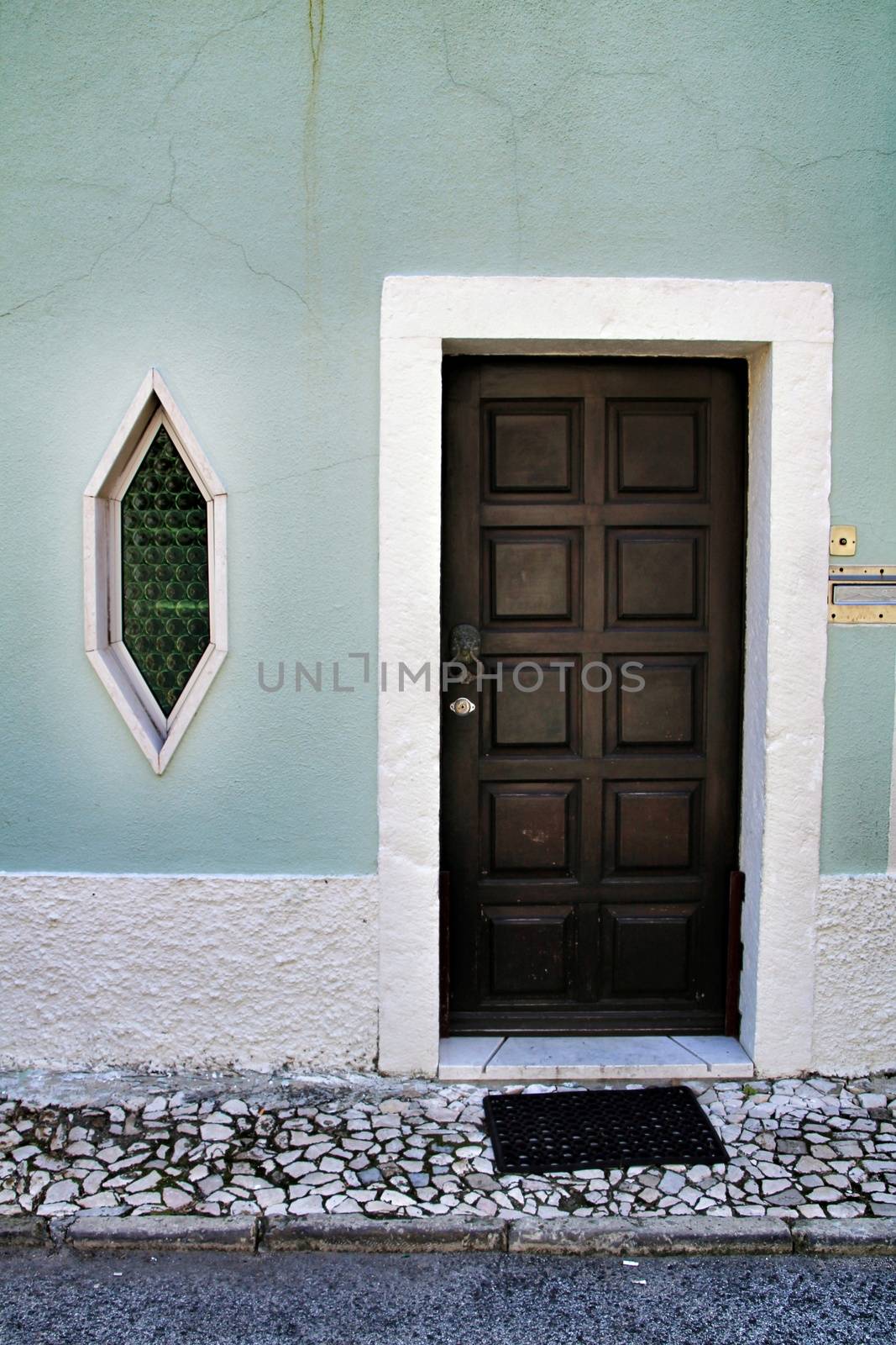 Wooden door and diamond shaped window by soniabonet