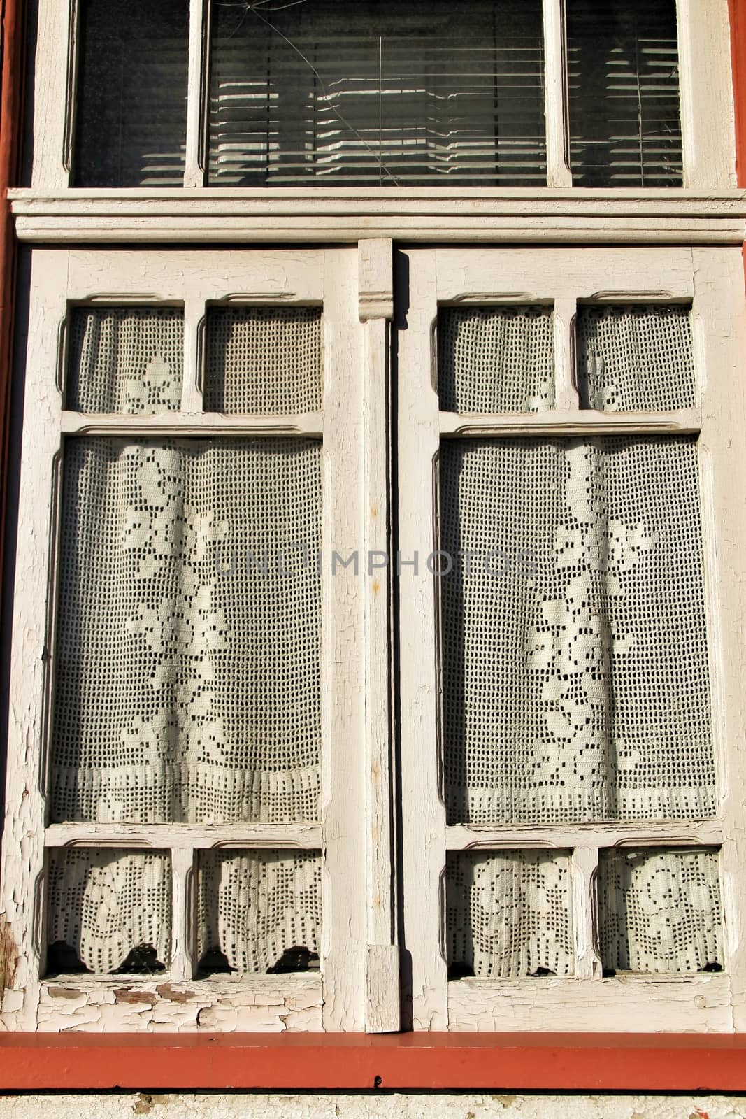 Wooden window painted in white and with crochet curtain by soniabonet