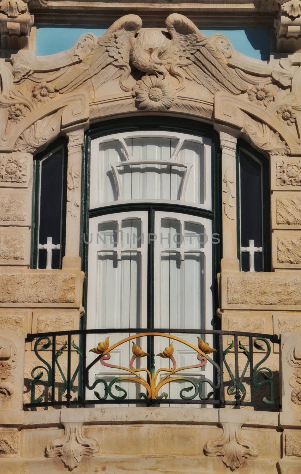 Art nouveau style facade next to the water canal in Aveiro villa by soniabonet