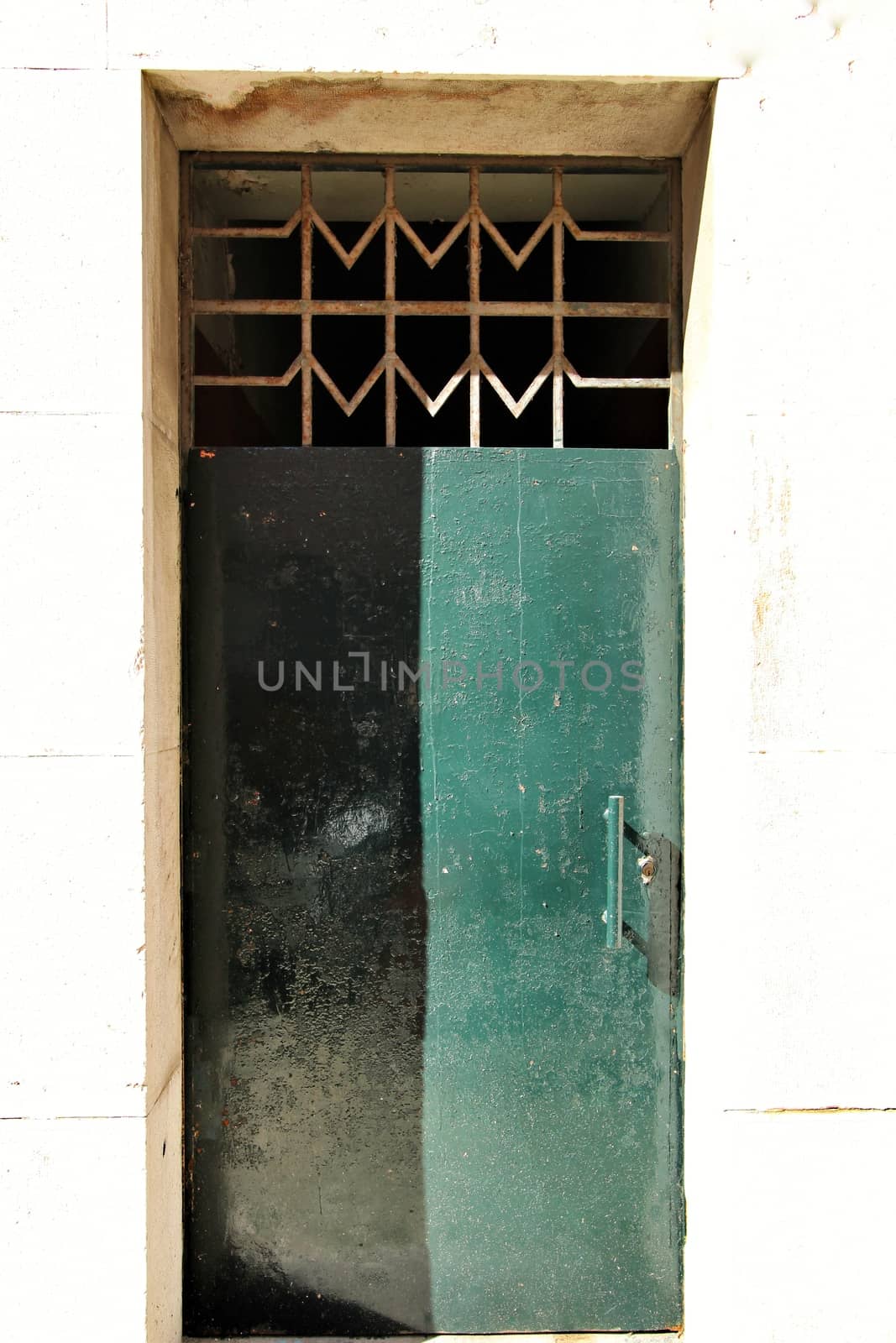 Old and colorful forged metal door seventies design in Lisbon, Portugal