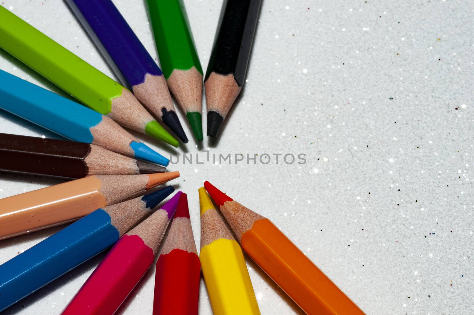 A right open colorful wheel of wooden pencils in white background