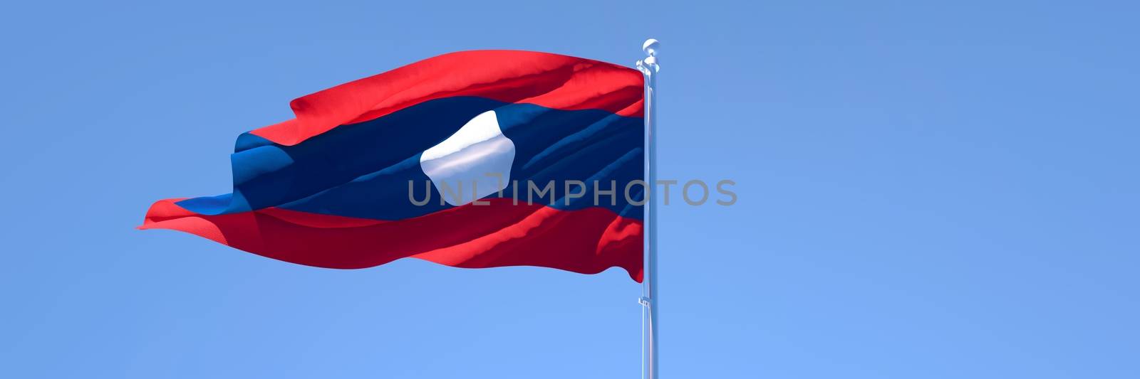 3D rendering of the national flag of Laos waving in the wind against a blue sky