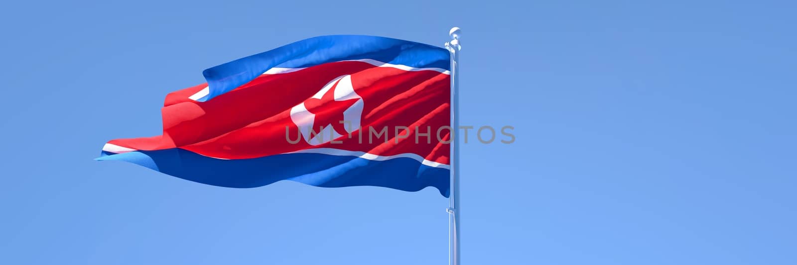 3D rendering of the national flag of North Korea waving in the wind against a blue sky