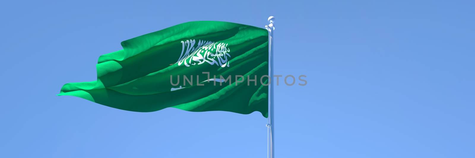3D rendering of the national flag of Saudi Arabia waving in the wind against a blue sky