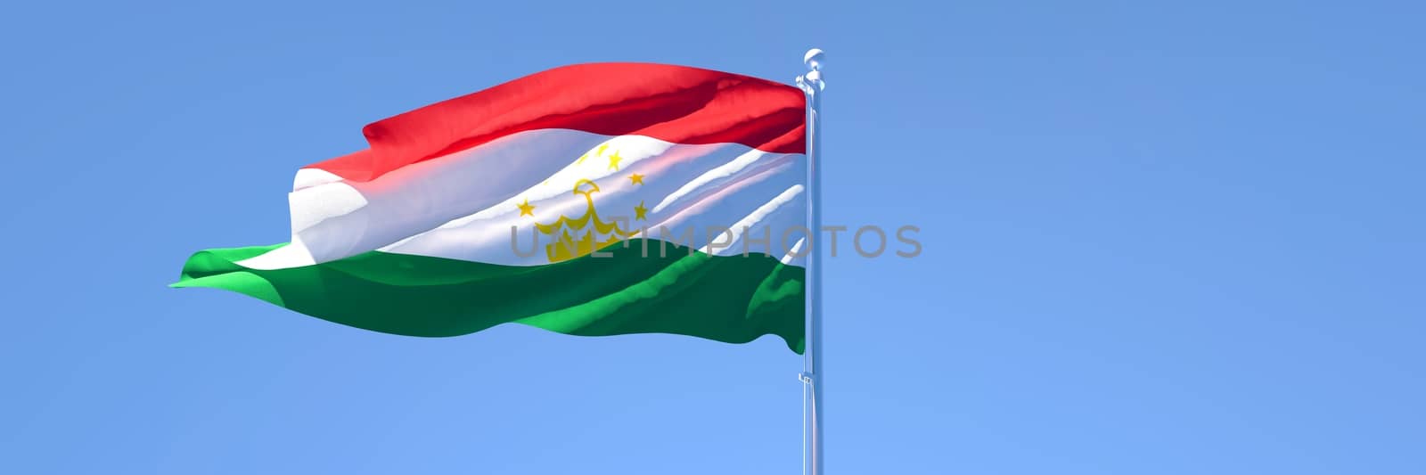 3D rendering of the national flag of Tajikistan waving in the wind against a blue sky