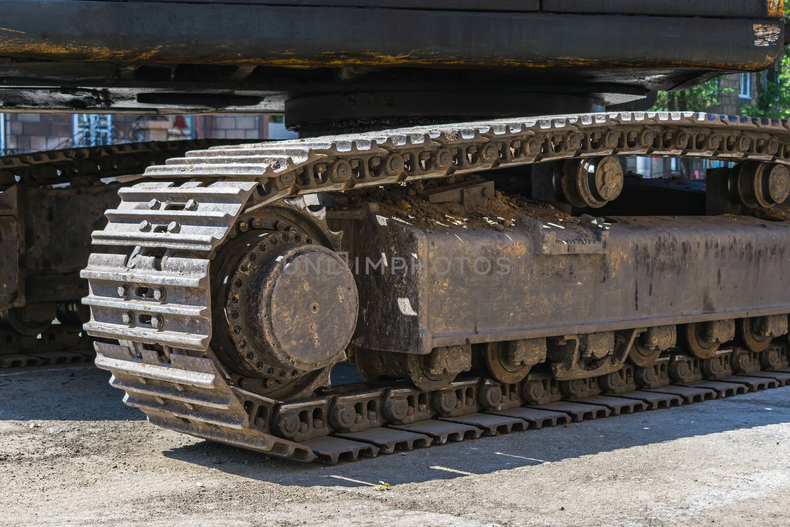 Roller and track of a large self-propelled machine close up