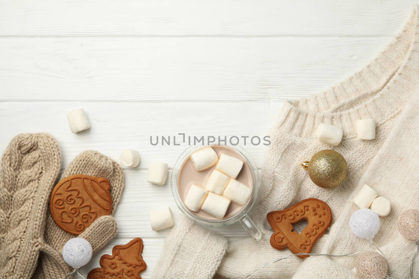 Winter concept with sweater, coffee with marshmallow and cookies by AtlasCompany