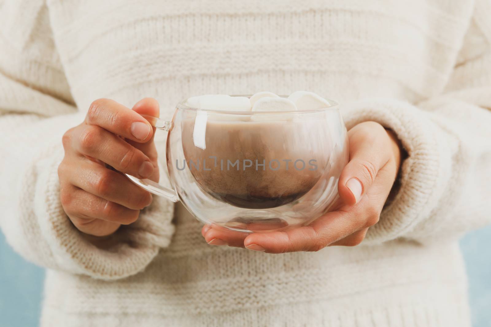 Woman hold cup of coffee with marshmallows, front view by AtlasCompany