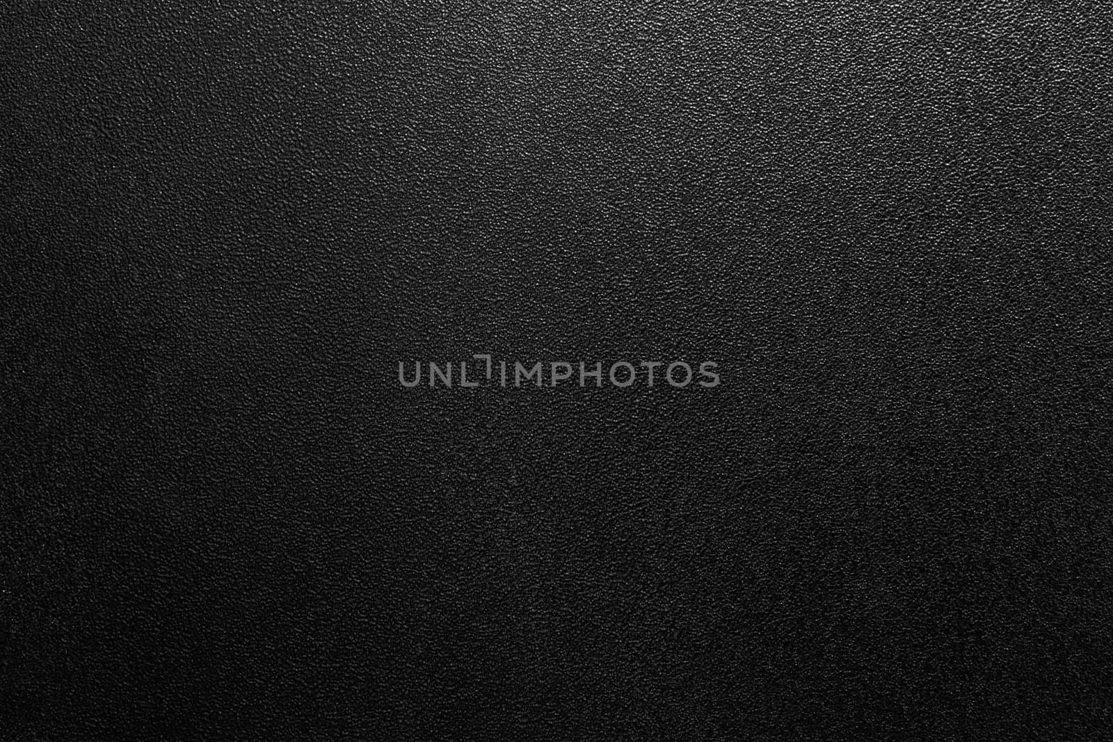 Dark full frame background of hammered powder paint coating on flat sheet steel surface. Also known as hammertone effect.