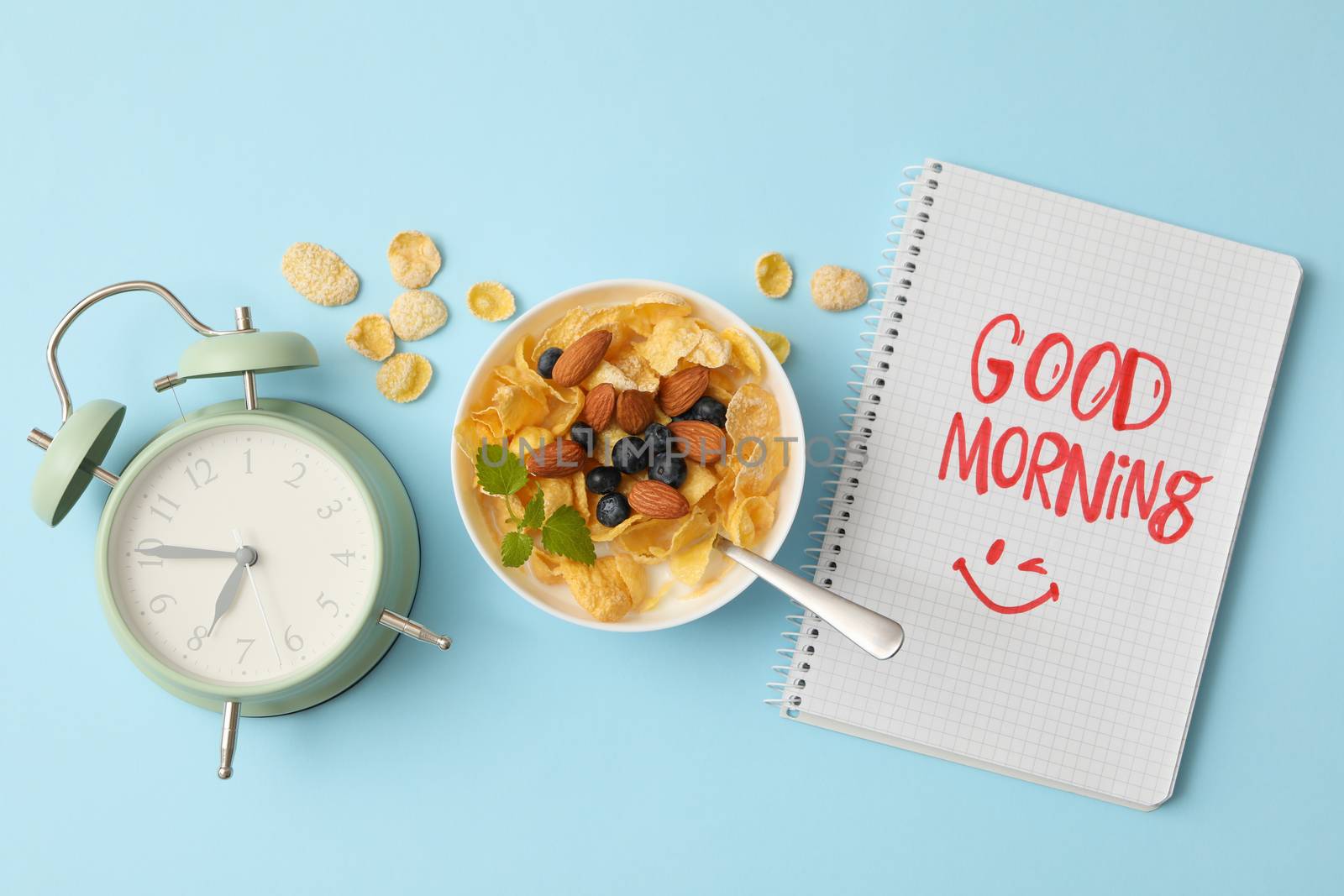 Concept of good morning with muesli on blue background