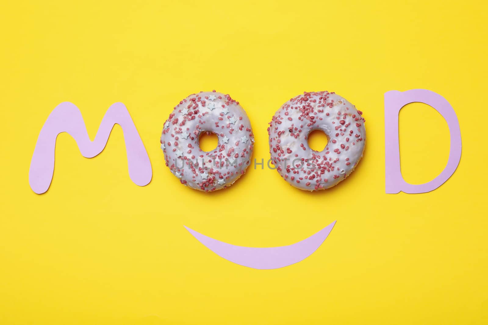Word Mood with donuts on yellow background
