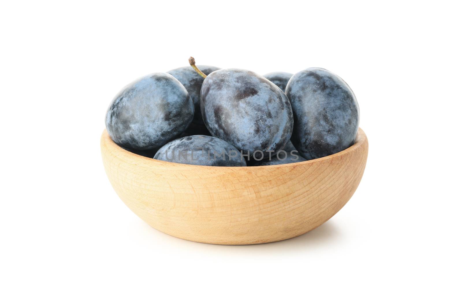 Bowl with plums isolated on white background