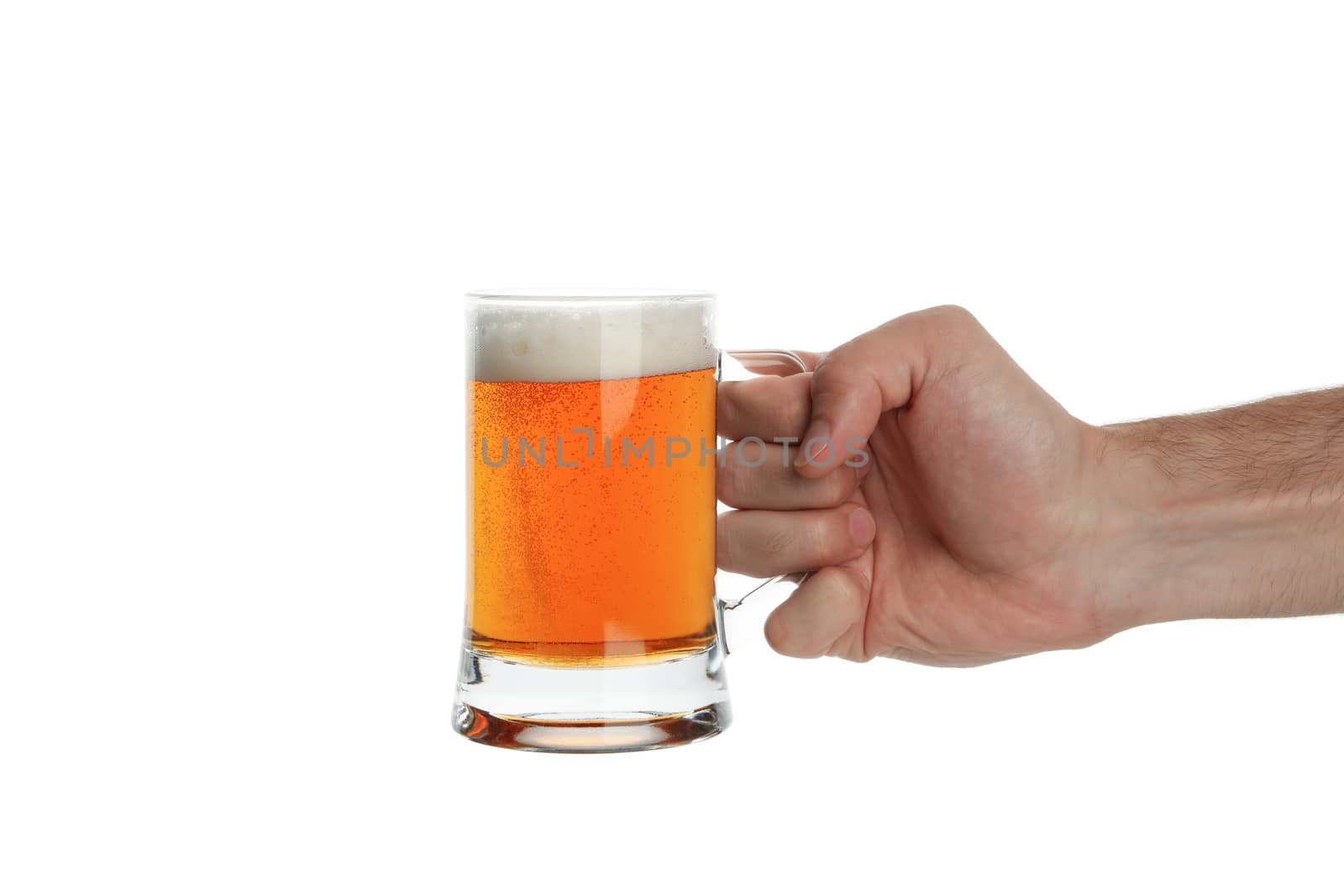 Hand holds glass of beer, isolated on white background