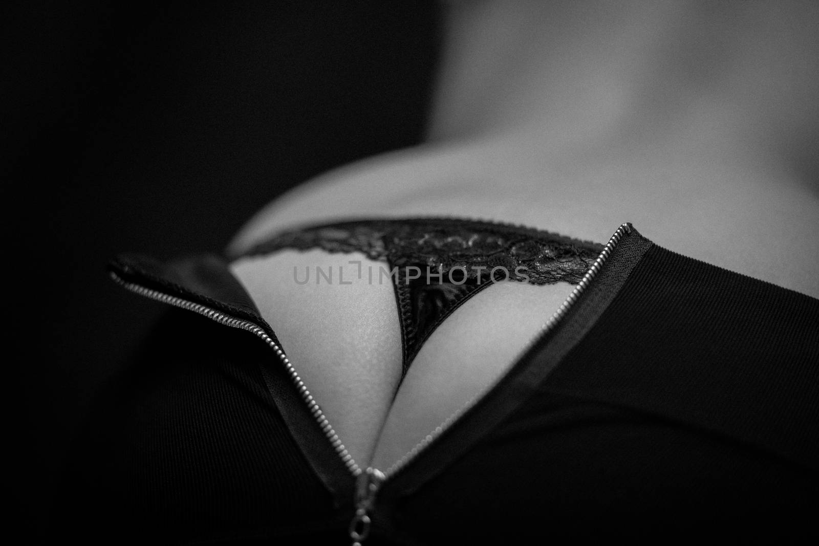 Rear view of a woman in black lingerie