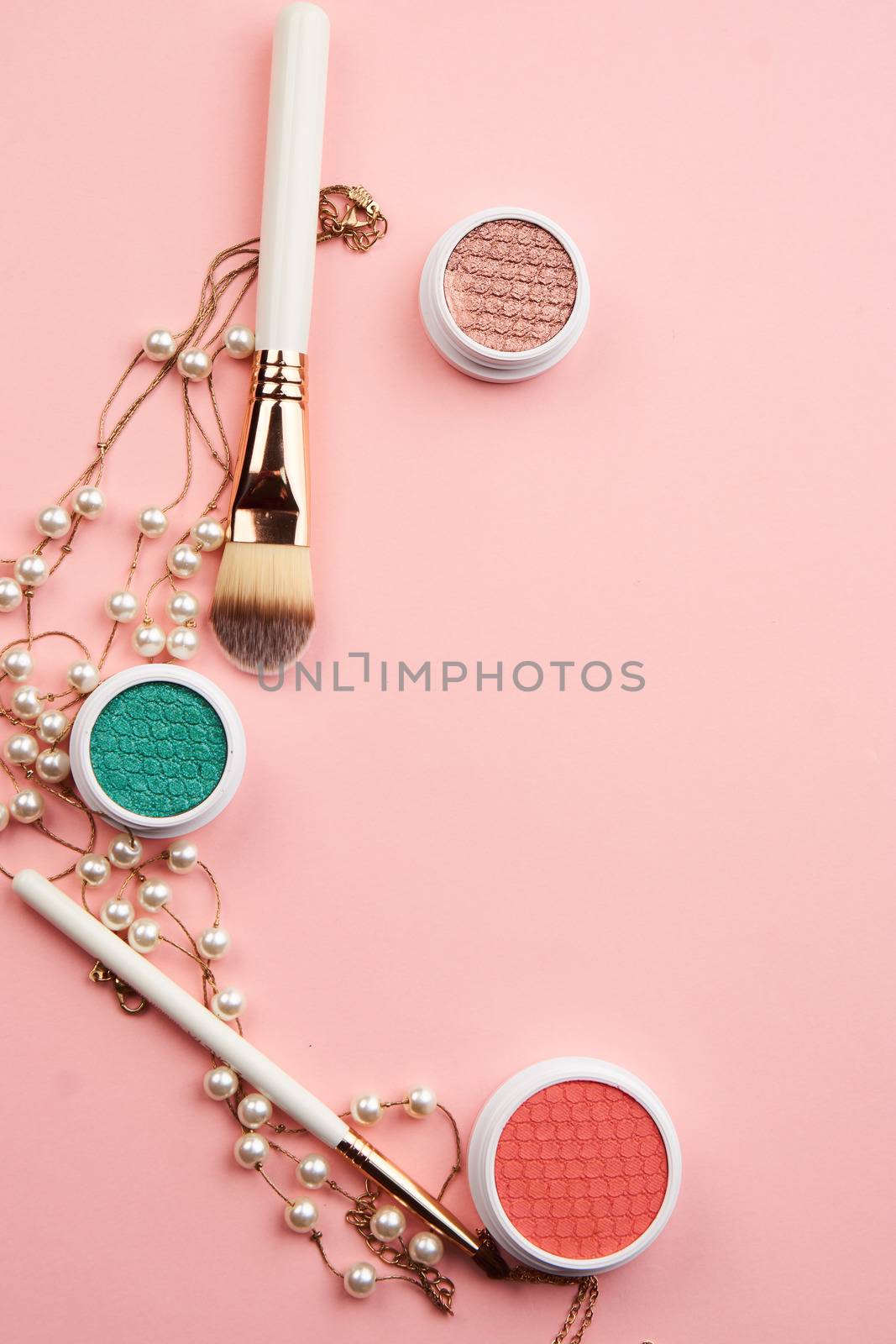 cosmetic accessories eyeshadow accessories makeup brushes merchandise collection professional cosmetics on pink background.