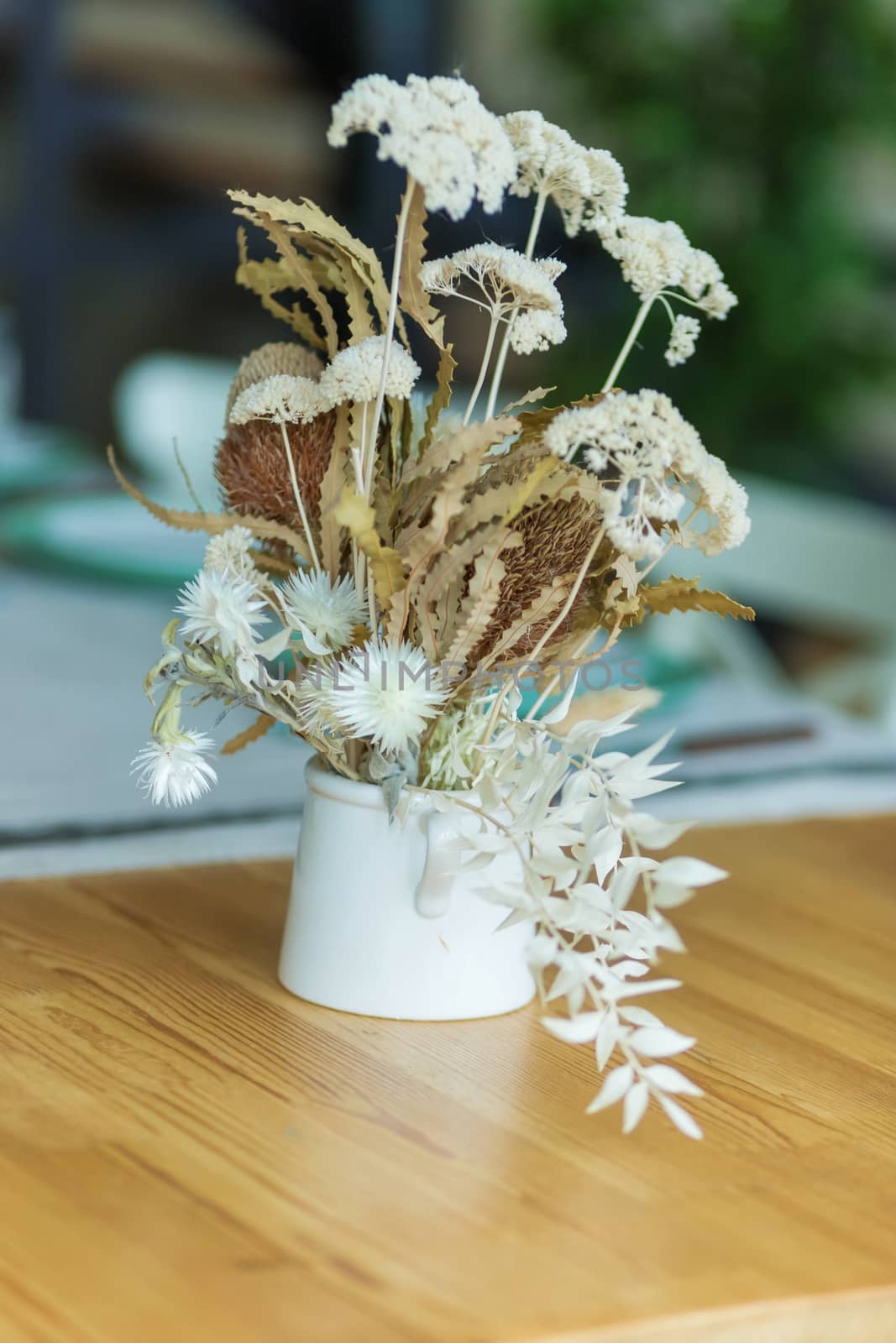 A Stylish table setting with dried flowers. by galinasharapova