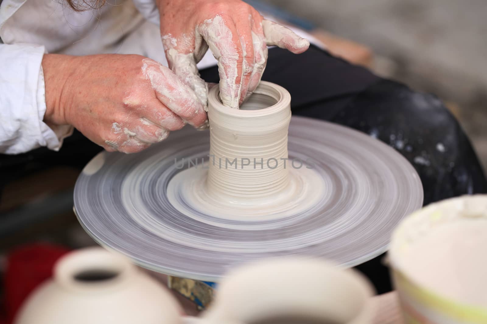 Dirty hands of a potter working 