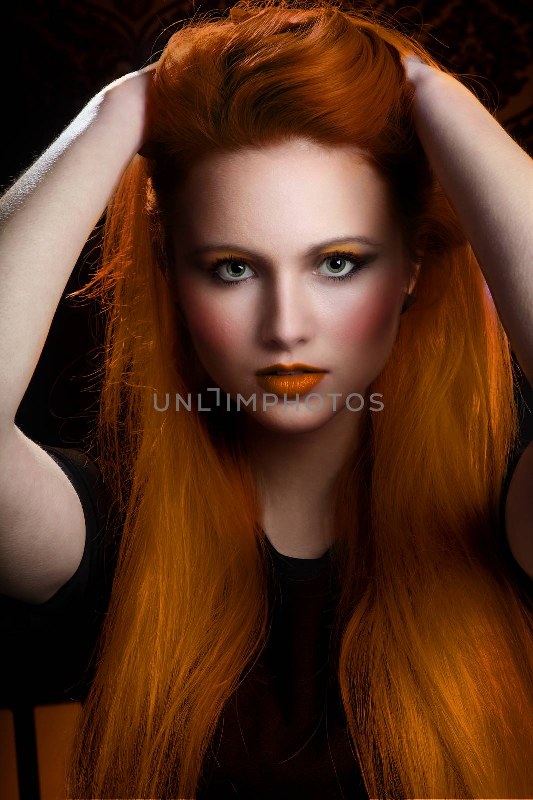 pretty girl with very long orange hair and green eyes. heavy makeup and clean face. Model with pretty face