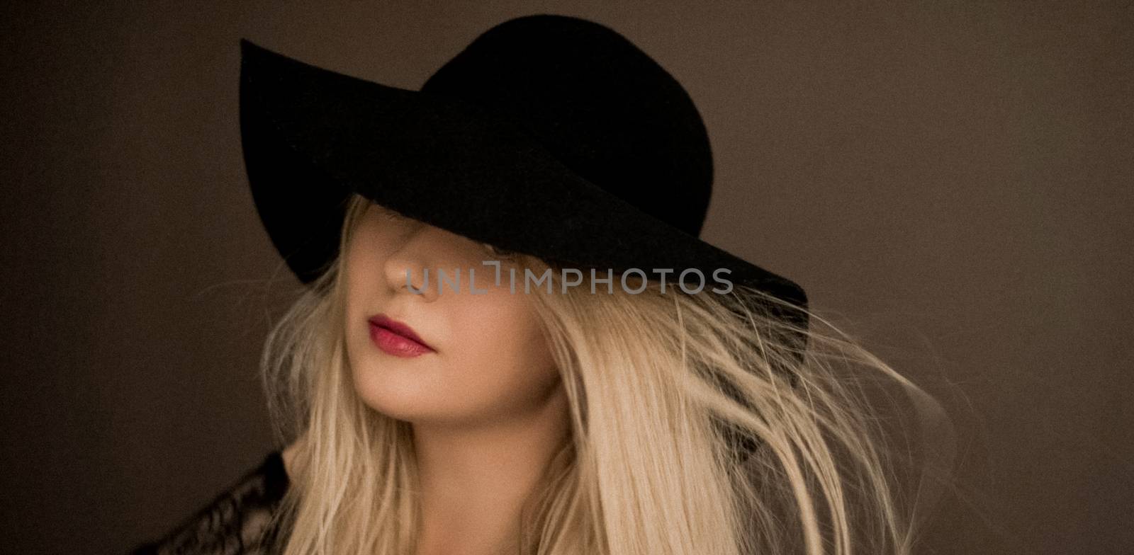 Classy blonde woman wearing a hat, artistic film portrait for fa by Anneleven