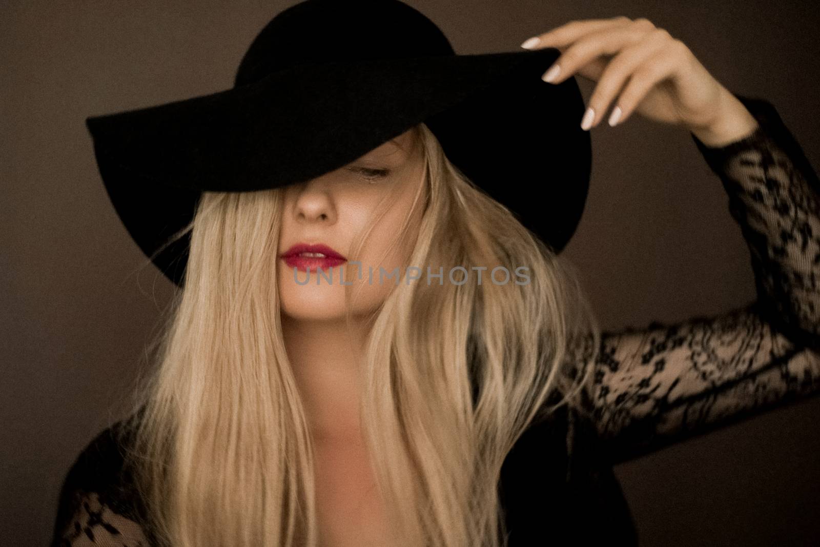 Classy blonde woman wearing a hat, artistic film portrait for fa by Anneleven