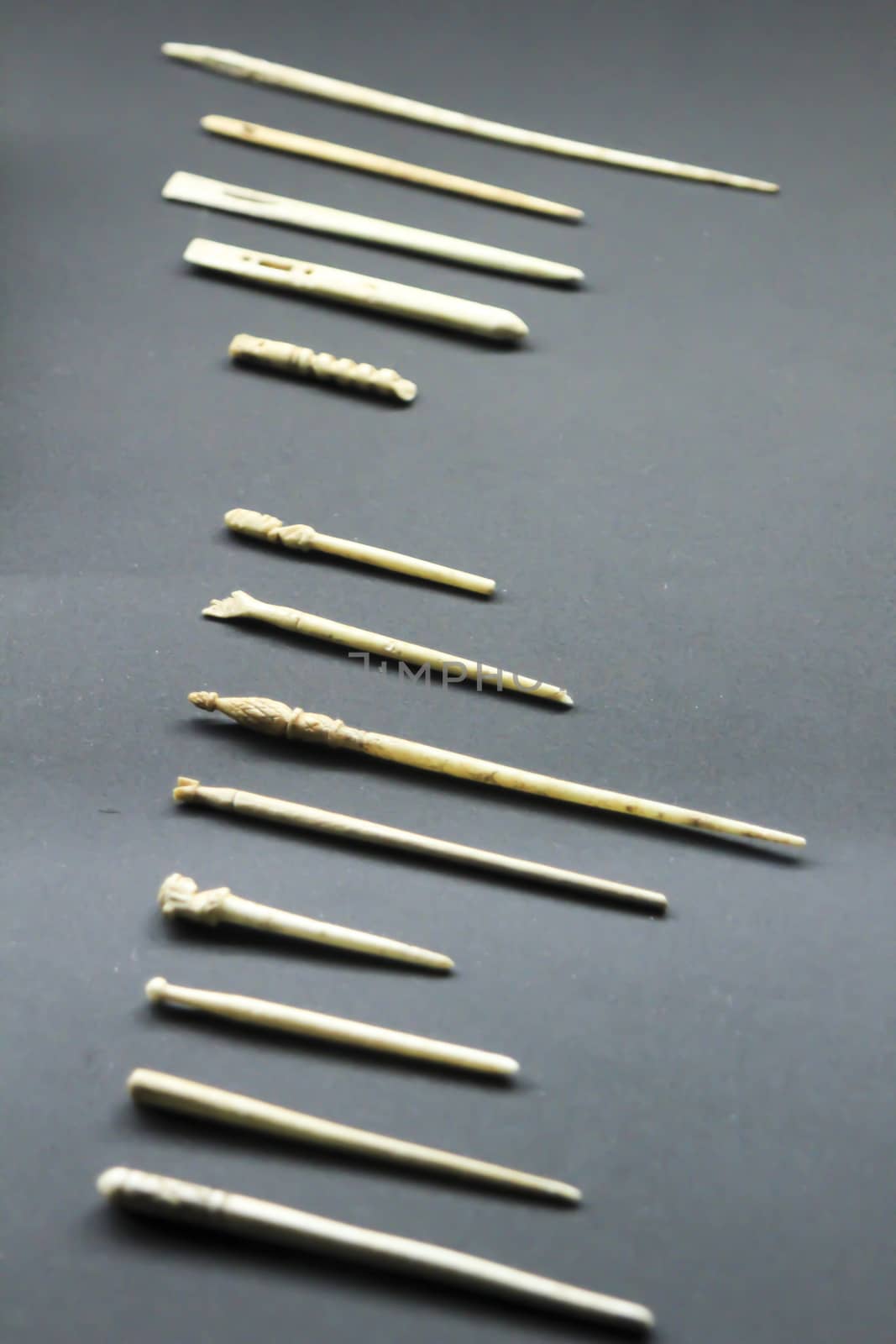Alicante, Spain- October 8, 2020: Roman bone needles to hold hair of the 1st and 2nd century exhibited at the Archaeological Museum of Alicante