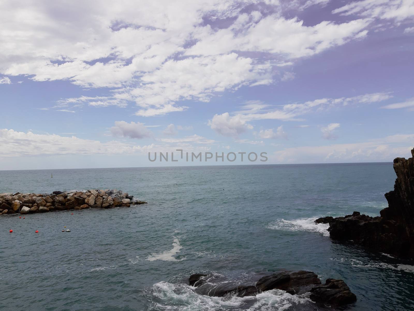 Cinque Terre, Italy - 09/02/2020: Beautiful landscape of a coastal fishing village, amazing view on many little colorful houses, traditional architecture of the little Italian town called Cinque Terre