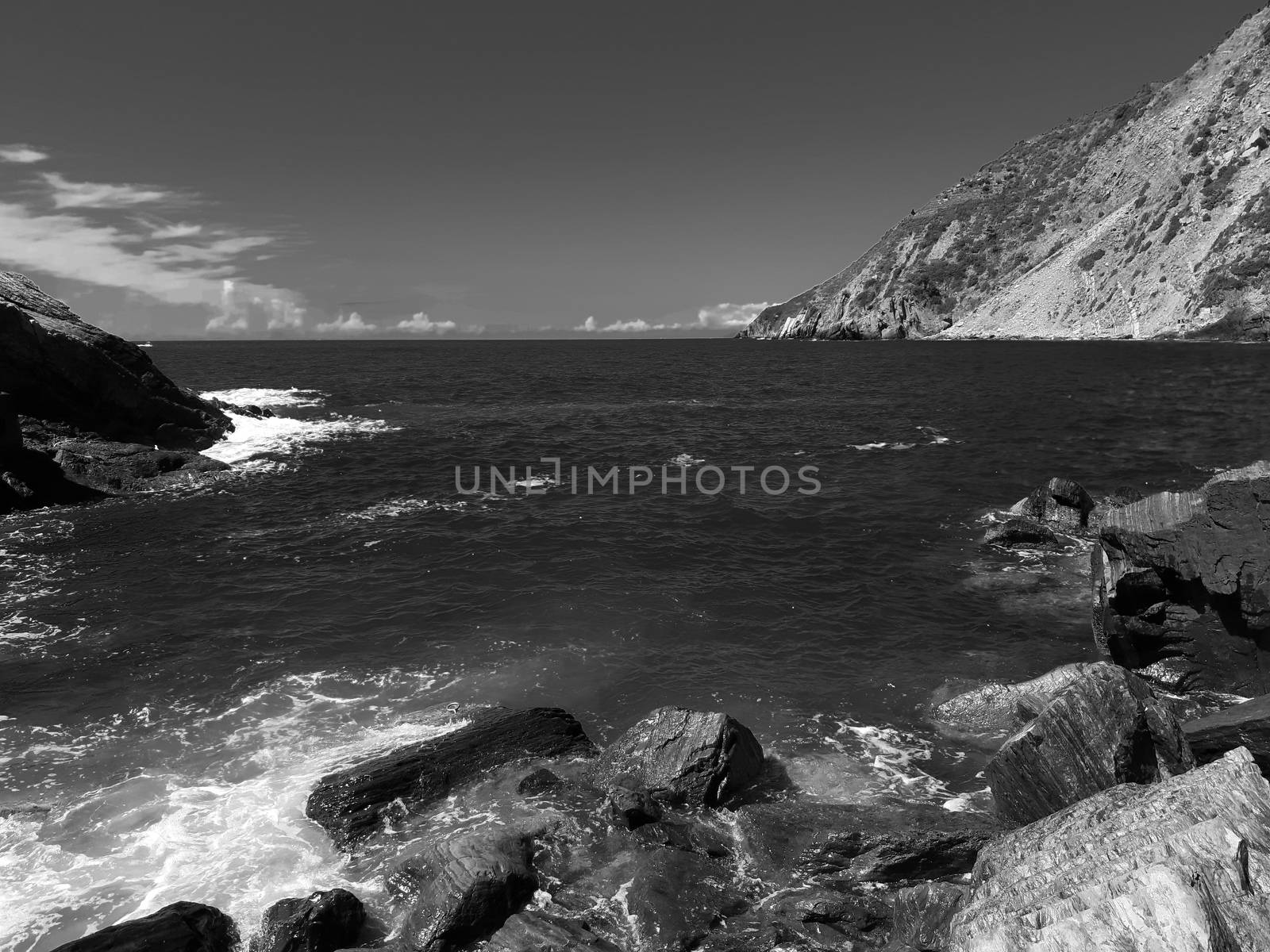 Cinque Terre, Italy - 09/02/2020: Beautiful landscape of a coastal fishing village, amazing view on many little colorful houses, traditional architecture of the little Italian town called Cinque Terre