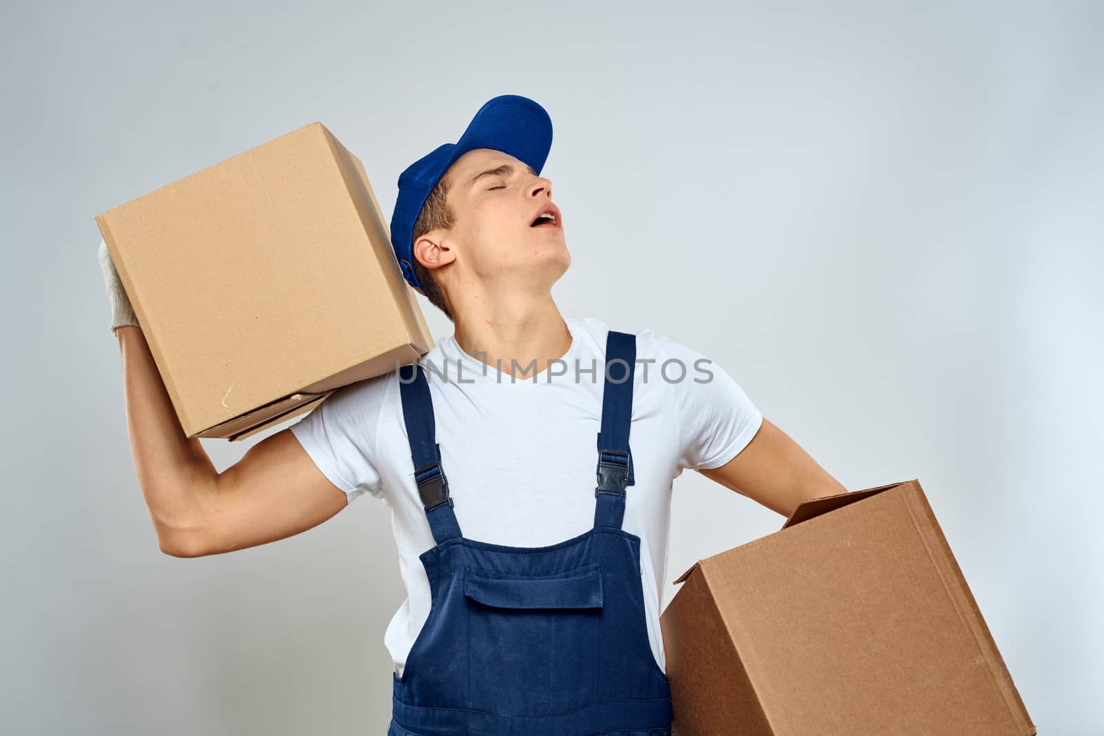 Man worker with box in hands delivery loading service packing service. High quality photo