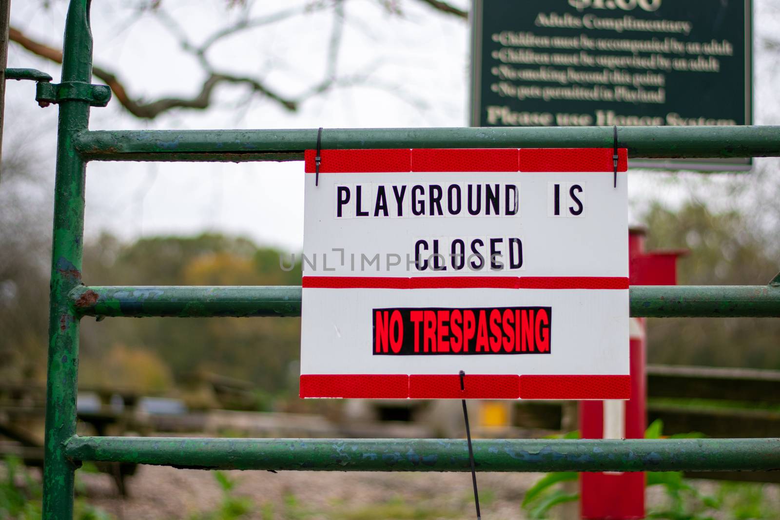 A Sign in Response to COVID-19 That Says the Playground is Closed and No Trespassing